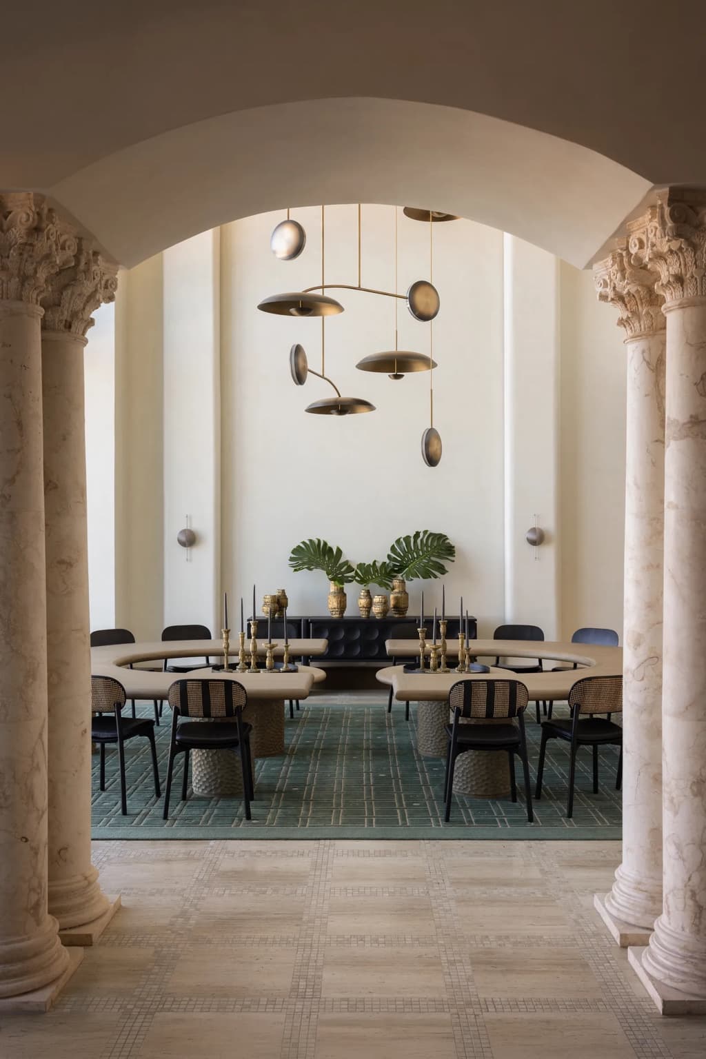 Dining room framed by columns and plaster walls