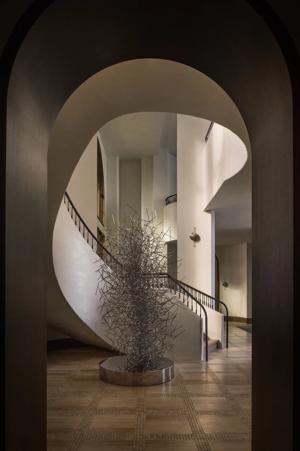 Curved plaster staircase inside the residence
